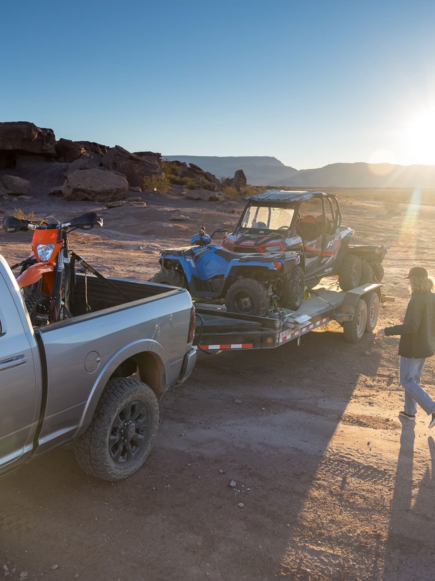 Truck hauling motorbike and ATVs